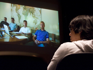 A student participates in a videoconference between UCSD and the National Geographic Society at Calit2's Atkinson Hall Auditorium. 