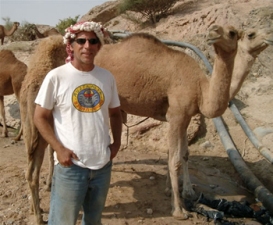 Tom Levy in the field, with camel