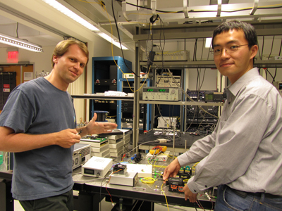 Bill Ping Piu Kuo (right) in the Photonics Lab