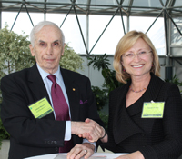 UCSD research vice chancellor Sandra Brown and Arthur C. Clarke Foundation chair sign agreement on n