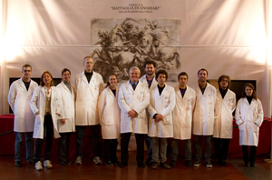 Maurizio Seracini, ’73 (center), standing with the entire research team in front of the scaffold covering the Vasari fresco.