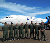 The UC San Diego Microgravity team poses in front of the special NASA plane they used for their expe