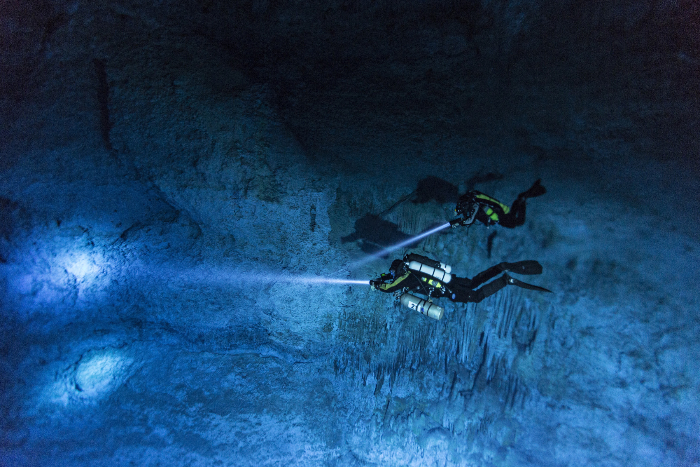 Divers Susan Bird and Alberto Nava search the walls of Hoyo Negro, an underwater cave on Mexico’s Yucatán Peninsula where the remains of “Naia,” a 12,000- to 13,000-year-old teenage girl, were found.