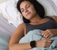 Woman wearing digital sleep tracker