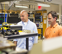 Eduardo Temprana and Nikola Alic in Photonics Systems lab of Qualcomm Institute