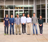 Yuhwa Lo, 3rd from right, with team members in front of Jacobs Hall