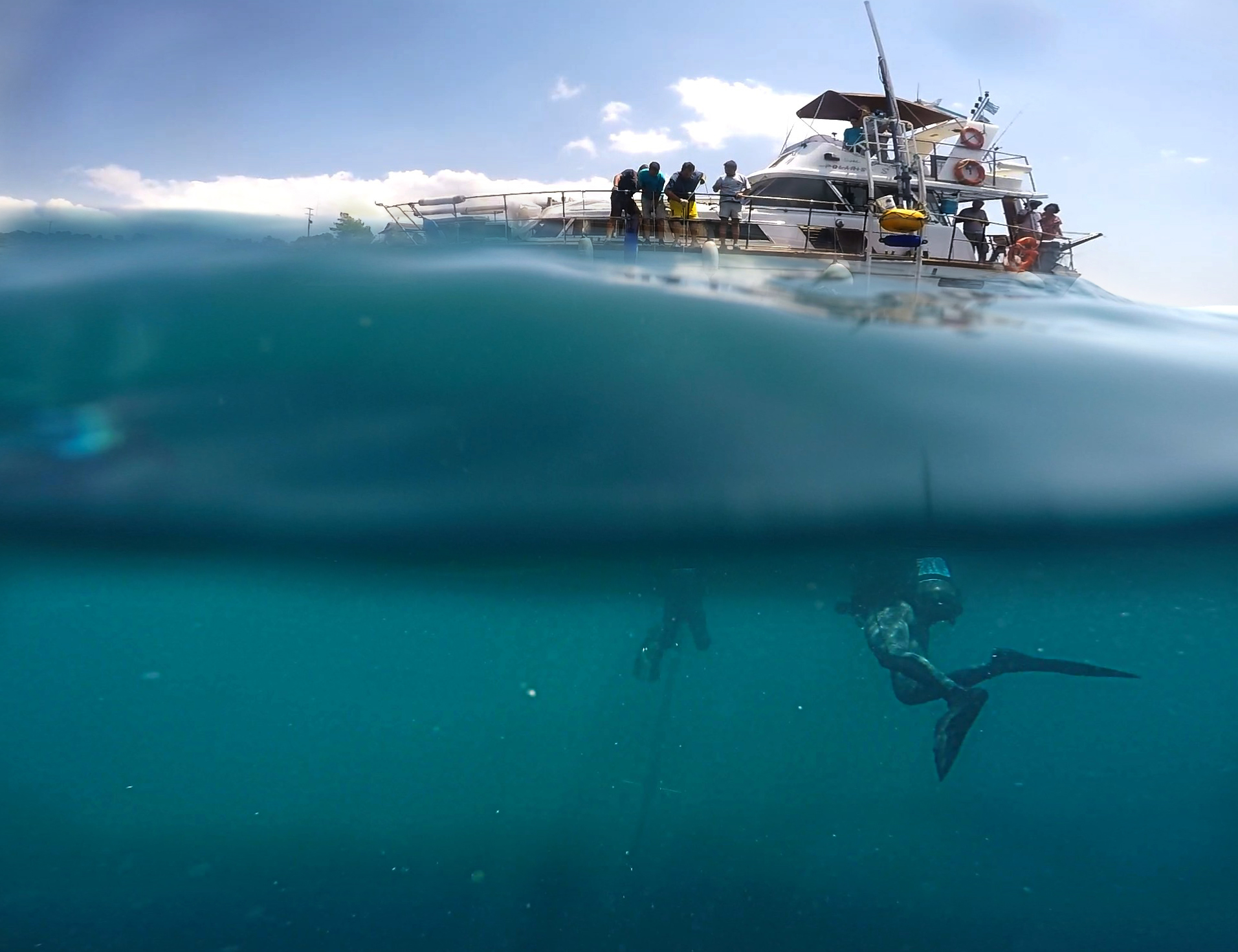 Divers below the research yacht