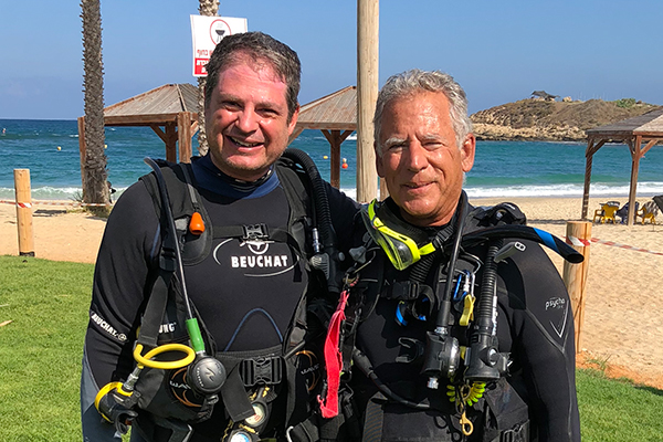 Tom Levy and Assaf Yasur-Landau in dive suits on Israel coast