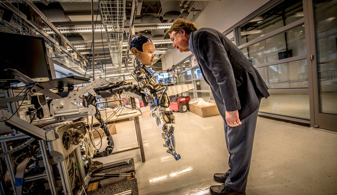 Larry Smarr with Diego-San, one of the robots in the Contextual Robotics Lab at Calit2/Qualcomm Institute