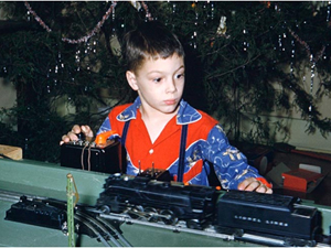 Calit2 Director Larry Smarr as a child, playing with his Lionel trains set. Smarr exhibited an affinity for science at a young age.