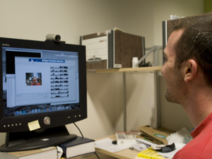 Machine Perception Lab researcher Jacob Whitehill operates a facial remote control that he designed as a proof-of-concept application.  