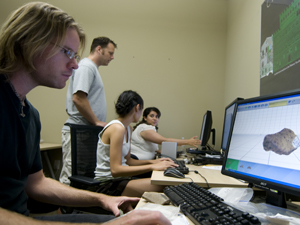 Eric Olson (foreground), Neil Smith (standing), Charlene Wang and Sorayda Santos are using a high-tech laser scanner and various software programs to create a Digital Pottery Informatics Database that will assist archaeolgists in creating 3-D reconstructions of artifacts.