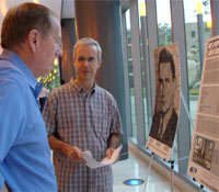 Ron Graham and Alon Orlitsky at poster session