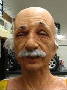 The Einstein robot head at UC San Diego performs asymmetric random facial movements as a part of the expression learning process.