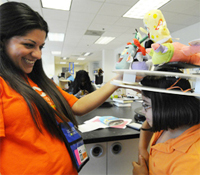 Jacobs School alumna Saura Naderi mentors student ahead of the 2011 Girls Hat Day